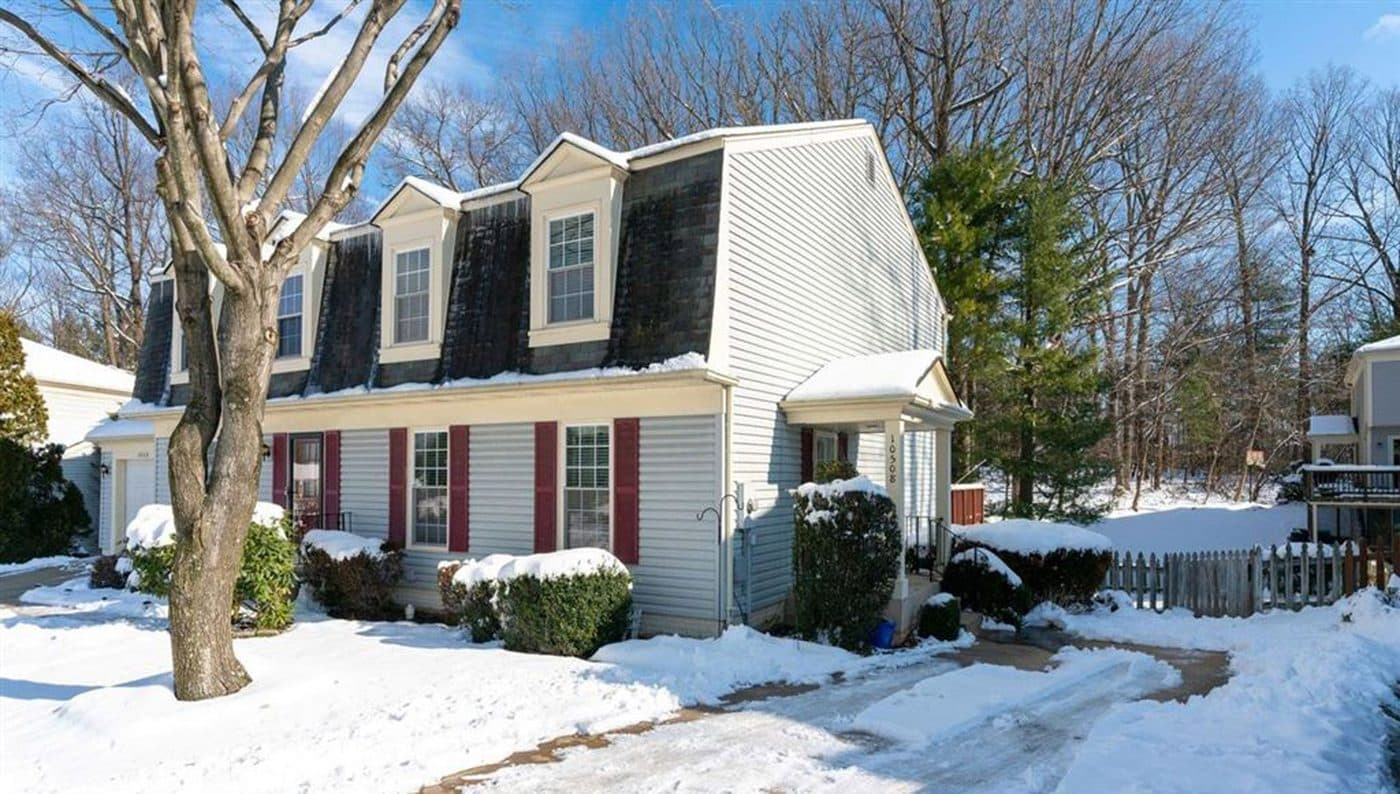 Colonial home in Burke after a snowfall